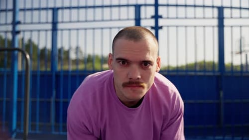 Man Showcasing Basketball Dribbling Skills in Slow Motion on Outdoor Court