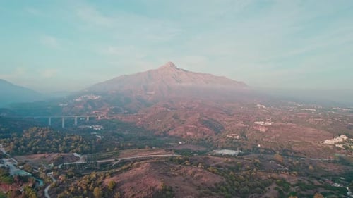 Lonely Mountain Overlooking the City From the Drone of Marbella Spain