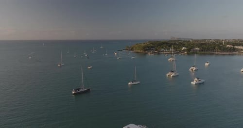 Aerial view of Grand Baie with yacht, boat and blue water, Mauritius.