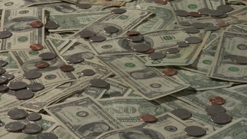 Pile of US Currency Money Dollars and Coins