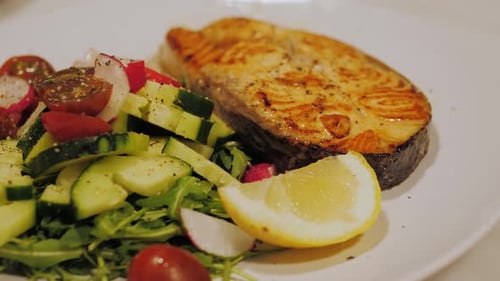 Salmon Steak with Mixed Green Salad Close Up