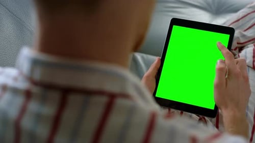 Finger Scroll Green Tablet Screen Closeup. Manager Use Digital Computer at Home