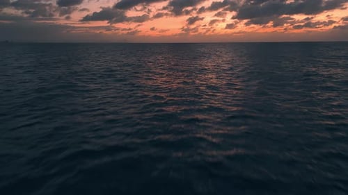 Orange Sunset Serene Glow Over Ocean Tropical Nature's Beauty Orange Sunset Sea's Expanse Spectacle