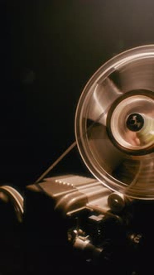 Vintage Film Projector with Reels in Operation