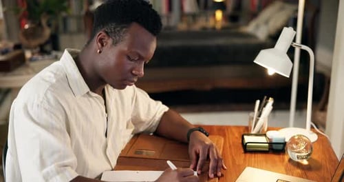 Research, notes and black man in home office planning agenda, schedule or writing ideas for article