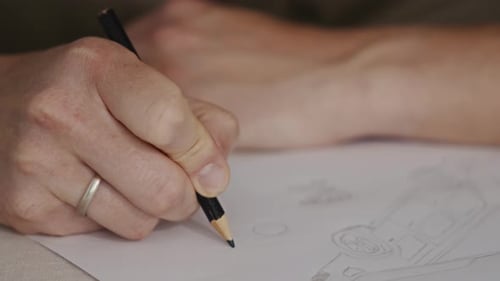 Hand Drawing a Design with a Pencil
