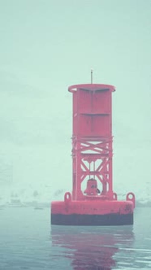 Red Metal Buoy Floating in Norwegian Sea