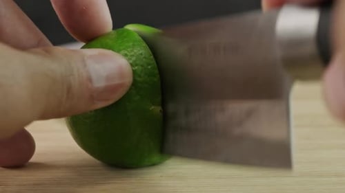 Close Up of a Lime Being Cut in Half