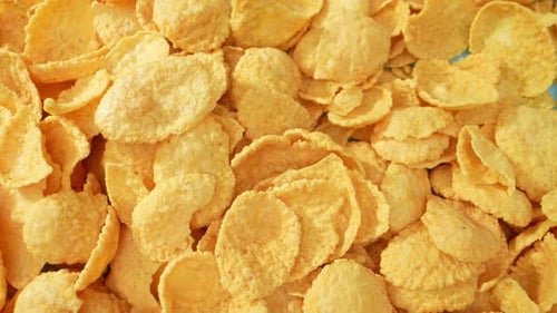Appetizing corn flakes in macro video