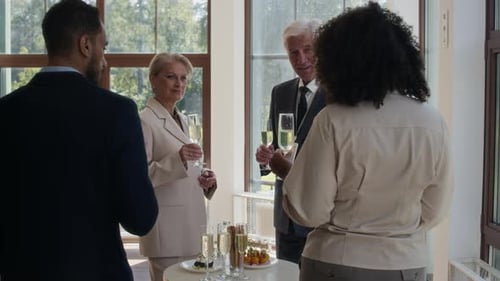 Four Diverse Business People Clinking Glasses with Champagne