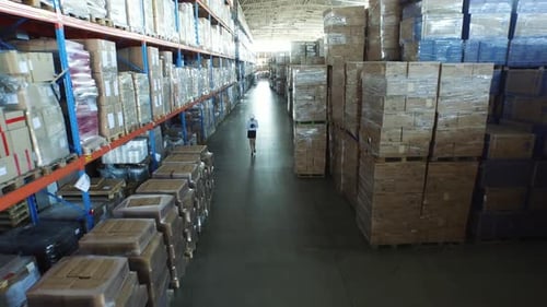 Aerial Drone Shot inside Logistic Warehouse