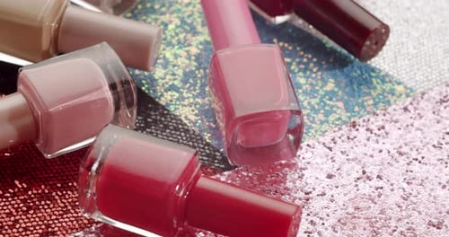 Assorted Nail Polish Bottles on Glittery Surface, Fashion Concept