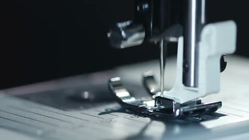 Equipment at Textile Factory. Closeup of Sewing Needle in . Sewing