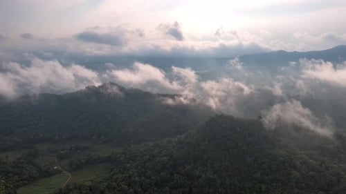 Time lapse video aerial view morning scenery Mist flowing over the high mountains.
