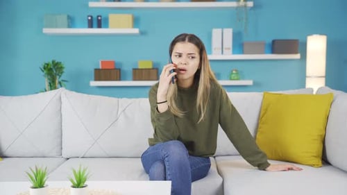 Woman Talking on Phone Looking Upset