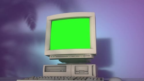 Retro Personal Computer with Keyboard on a Desktop with Green Screen