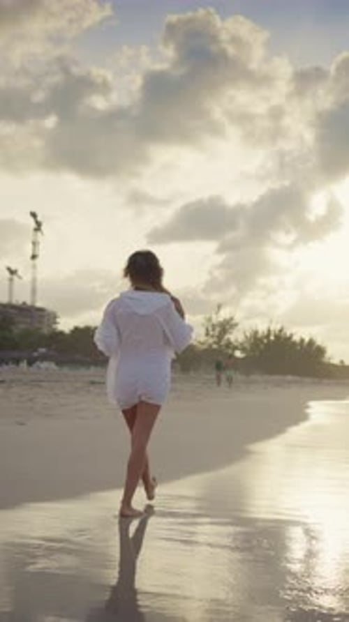 Rest on Ocean Coastline Back View of Lonely Woman Strolling on Beach in Sunset or Sunrise Slow