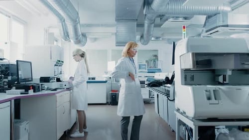 Women Working in Modern Laboratory with Medical Equipment