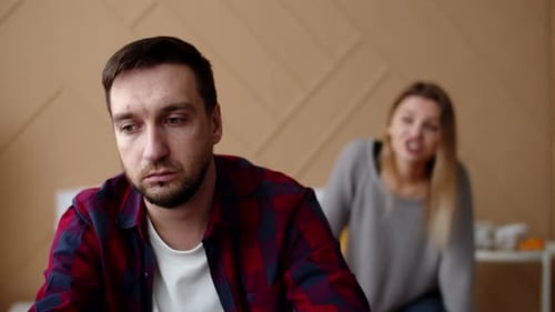 Couple Arguing in Bedroom, Distraught Man