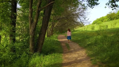 Girl Walking By The Trail At The Forest 2