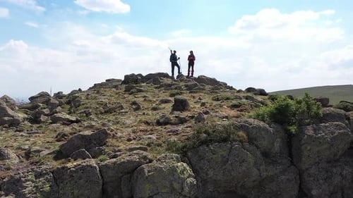 Aerial View Of Hikers Enjoying The View On The Hill