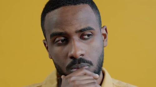 Young Adult Man Thoughtful in Close Up Shot