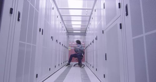 Person Using Tablet in Pristine Data Center