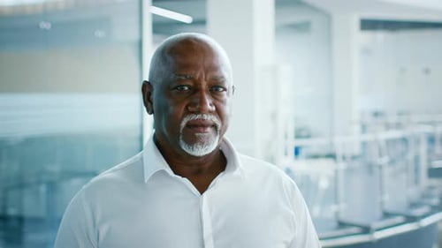 Mature African American Businessman in Modern Office Environment