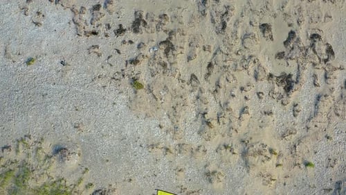 Aerial View of a Kite Flying in the Sky on the Seashore