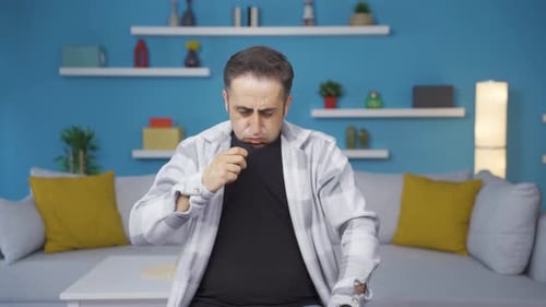 Man Fanning Himself Due to Overheating