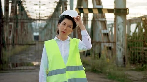 Female Engineer on Bridge Takes Off Hard Hat