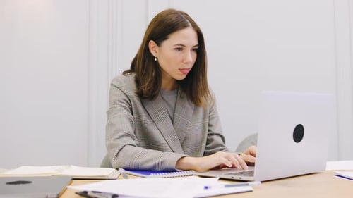 Woman Works on Laptop then Closes It