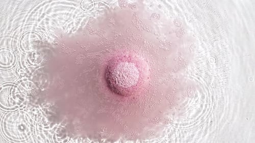 Pink Bath Bomb Dissolving Underwater for Spa Day