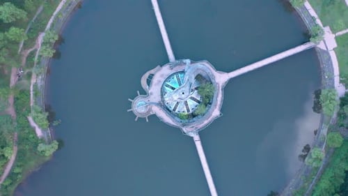 Aerial top down view of Ho Thuy Tien abandoned water park with huge dragon structure, mountains and