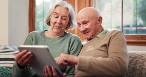 Senior couple, tablet and laughing in home while reading news, social media post and ebook app