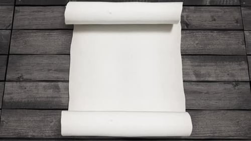 White Parchment Scroll opens on wooden background