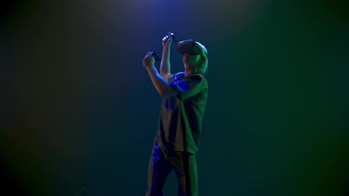 Man Dances with VR Headset and Controllers