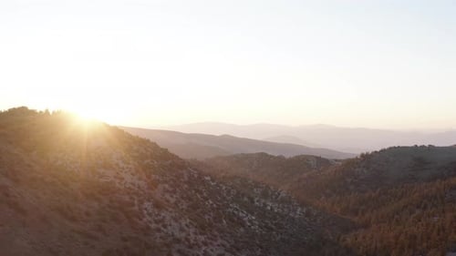Sunrise Over Mountain Range with Orange Light