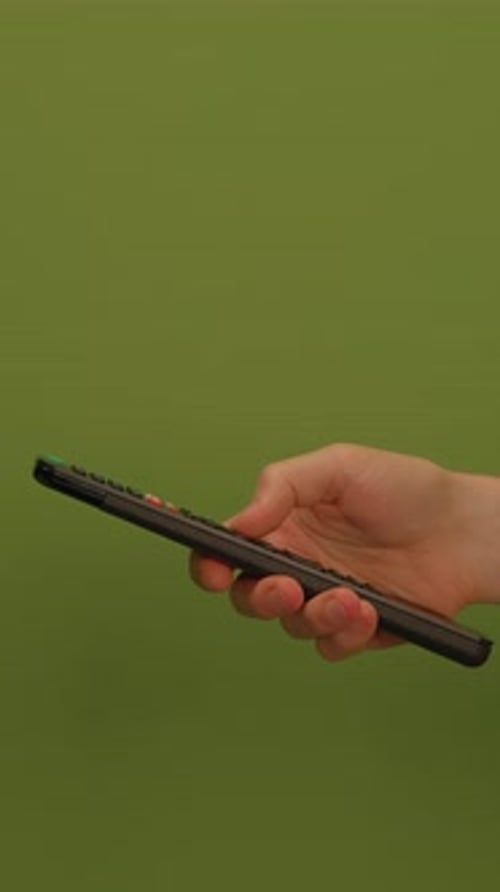 A Hand Holds a Smartphone Against a Vibrant Green Background Highlighting Modern Tech
