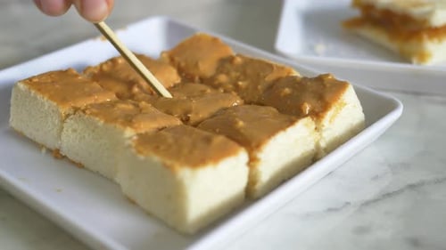 Top View of Peanut Butter and a Bread on Plate on Black Background