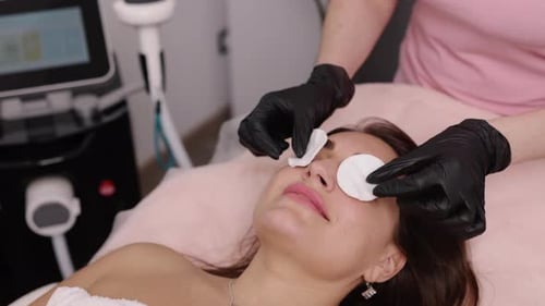 Woman Getting Cotton Pads Applied at Spa