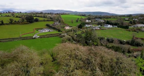 A reveal drone shot of St Mullin's church of Ireland Monastic site and graveyard in County Carlow