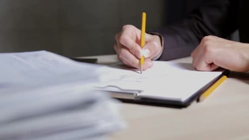 The design engineer works with drawings. Calculation and planning of buildings.