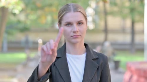 Outdoor Portrait of Tense Businesswoman in Denial