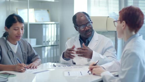 Medical Professionals Collaborating at Bright Workplace