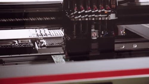 Close up of Robotic pick and place assembling electronic PCBs.