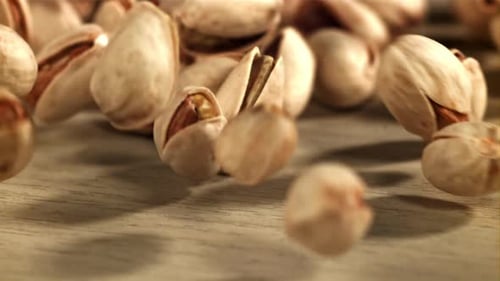 The Pistachios Fall on the Table Filmed on a Highspeed Camera at 1000 Fps