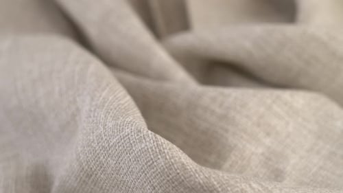 Beige Fabric Rotate in Circle Linen or Cotton Textile Material Tissue