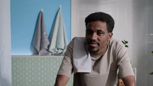 Man In Bathroom With Towel Relaxing