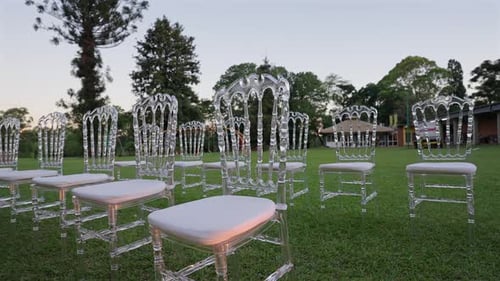 Wedding Ceremony Decoration with Clear Chairs on Lawn